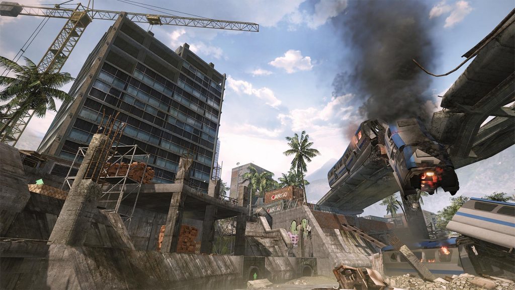 Warface multiplayer map with an unfinished high-rise building, construction crane, and a burning derailed train hanging off an elevated monorail track in a tropical setting