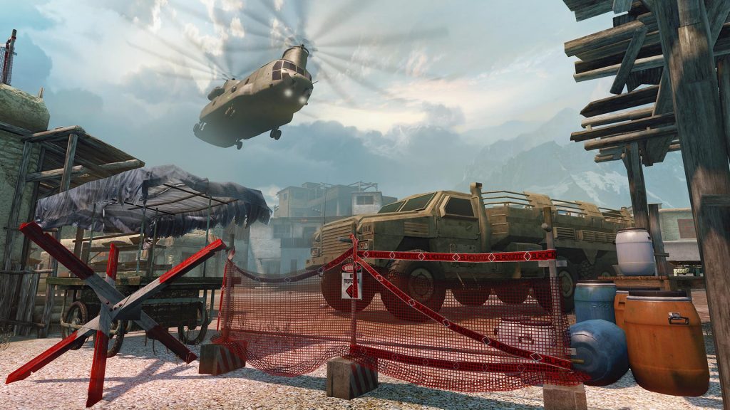 Military checkpoint in a snowy mountain outpost with a twin-rotor helicopter flying overhead and an armored transport truck behind a red barrier fence, in Warface